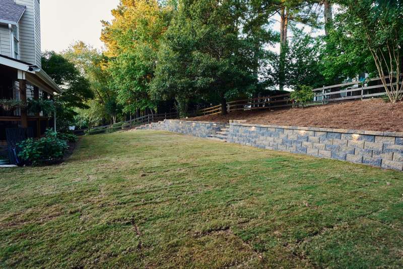 new sod lawn in front of the finished retaining wall