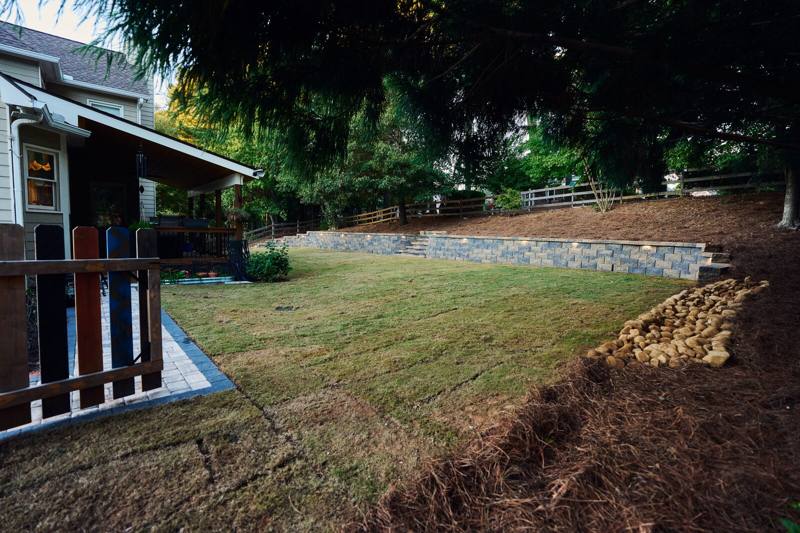 retaining wall with lighting behind a home in Forsyth County GA